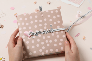 Image of hands holding a homemade scrapbook